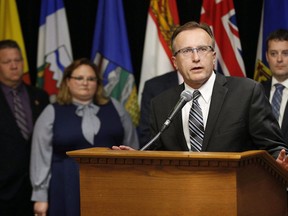 Jim Reiter, Saskatchewan Minister of Health responds to a reporter's questions at a press conference during the Conferences of Provincial-Territorial Ministers of Health in Winnipeg on June 28, 2018.
