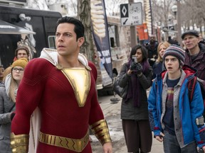 This image released by Warner Bros. shows Zachary Levi, left, and Jack Dylan Grazer in a scene from "Shazam!"