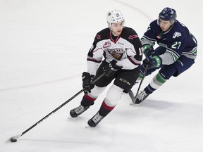 Dawson Holt of the Vancouver Giants, left, has switched to Beast Mode for the WHL playoffs and leads his team at both ends of the rink.