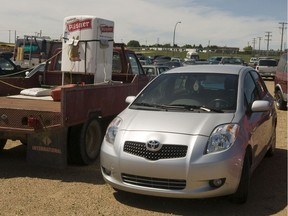 A newer Toyota Yaris sits alongside an older truck in the City of Saskatoon's Impound in Saskatoon, Saskatchewan on July 16th, 2009.