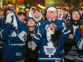 Leafs' fans face the reality the Toronto Maple Leafs will lose to the Boston Bruins towards the end of  Game 7, during the First Round playoffs, as they watch on the big screens outside of Scotiabank Arena on Bremner Blvd in Toronto, Ont. on Tuesday April 23, 2019. Ernest Doroszuk/Toronto Sun/Postmedia