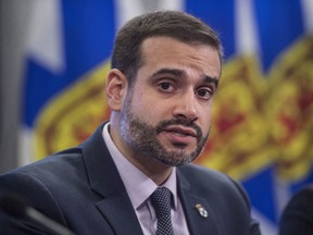 Nova Scotia Education Minister Zach Churchill speaks during a press conference in Halifax on January 24, 2018. Nova Scotia is moving to enforce stricter safety reporting protocols for teachers and others employed by the education system including mandatory criminal record checks every five years. Education Minister Zach Churchill says proposed amendments to the Education Act would also require annual declarations indicating that an individual has not been convicted of an offence.