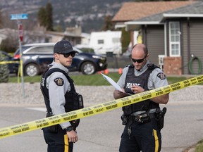 RCMP officers work outside a crime scene in Penticton, B.C., on Monday April 15, 2019. The RCMP say a 60-year-old man is in custody after four targeted shootings in Penticton, B.C., on Monday left two men and two women dead in what a senior police officer described as a "very dark day" for the city.