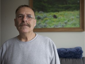 Standing next to one of his photographs, John Lozowchuk says an April 8 collision where his Mini Cooper was badly damaged slowed his hobby down substantially as all of his camera equipment was damaged in the crash. In his home on May 3, 2019 Lozowchuk said he feels he wasn't properly compensated for his vehicle and didn't have a chance to say how the crash affected him during the court proceedings. (Morgan Modjeski/The Saskatoon StarPhoenix)