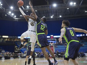 Saskatchewan Rattlers forward Tavrion Dawson goes to shoot the ball past Niagara forward Yohanny Dalembert during the Canadian Elite Basketball League inaugural game at SaskTel Centre in Saskatoon, Sk on Thursday, May 9, 2019.