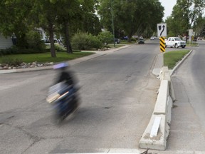 A temporary barrier preventing left turns from Clarence Avenue on to Glasgow Street in Saskatoon is seen in this June 2018 photo. City council voted to remove the barrier.