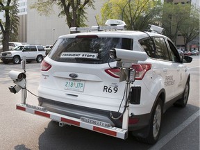 A City of Saskatoon parking enforcement vehicle patrols downtown Saskatoon on Aug. 27, 2015.