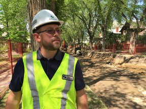 Matt Jurkiewicz, the City of Saskatoon's interim director of construction and design, tells reporters how water and sewer replacement will affect the City park and Riversdale neighbourhoods at the corner of Fifth Avenue and Kings Street on Wednesday, May 29, 2019. (PHIL TANK/The StarPhoenix)