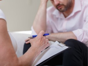 Image of female counselor helping man with problem. Photo to illustrate Doug Todd column on cognitie behavioural and other therapies. Getty Images/iStockphoto [PNG Merlin Archive]