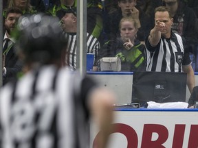 Shot-clock operator Ian Wilson signals readiness for the start of play during a NLL one-game sudden-death Western Division semifinal between the Saskatchewan Rush and the Colorado Mammoth at SaskTel Centre in Saskatoon on Friday, May 3, 2019.