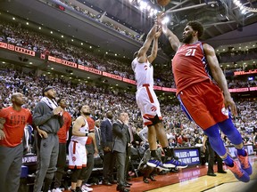 Philadelphia 76ers centre Joel Embiid (21) fails to stop Toronto Raptors forward Kawhi Leonard's (2) last-second basket during second half NBA Eastern Conference semifinal action in Toronto on Sunday, May 12, 2019.