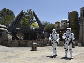 Stormtroopers patrol the Tie Echelon Stage during the Star Wars: Galaxy's Edge Media Preview at Disneyland Park, Wednesday, May 29, 2019, in Anaheim, Calif.