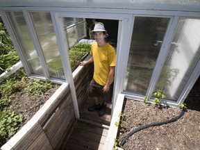 Jared Regier runs Chain Reaction Urban Farm with his wife Rachel on garden plots at their home and elsewhere in Saskatoon. Included is a mini-nursery and handmade collection boxes for subscribers to their vegetables. (photo by Richard Marjan)