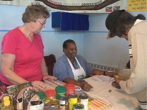 The CHEP Fresh Food Market is one of the other community services also operating from St. Thomas Wesley United Church. Volunteers Fran Burgess and Barb Arop serve customer Donald Bird.