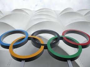 This July 15, 2012 file photo shows the Olympic rings displayed outside the basketball arena in the Olympic Park before the start of the 2012 Summer Olympics in London.