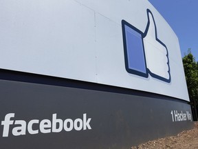 This July 16, 2013 file photo shows a sign at Facebook headquarters in Menlo Park, Calif.
