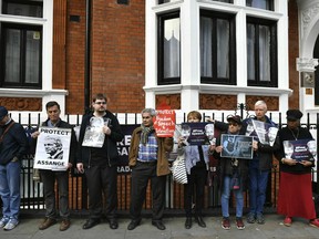 Julian Assange supporters gather outside the Ecuadorian embassy in London, Monday May 20, 2019. Swedish authorities on Monday issued a request for a detention order against WikiLeaks founder Julian Assange, who is now jailed in Britain, a Swedish prosecutor said.