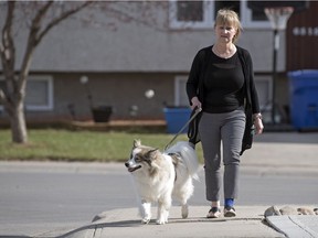 Pam Jelinski and her dog Yoda, a Siberian husky border collie mix, outside their home in Regina.