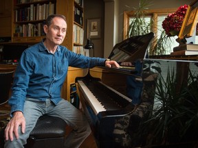 **BEST PHOTO** REGINA, SASK : June 6, 2019  -- Composer David McIntyre sits at his piano on which he works in his Regina home. McIntyre is the former director of the Prairie Pride Chorus. BRANDON HARDER/ Regina Leader-Post