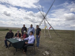 Chief of the Ahtahkakoop First Nation Larry Ahenakew, left to right front row, Chief of the Mosquito First Nation Tanya Aguilar-Antiman, farmer and land owner Jim Gilroy, and Chief of the Federation of Sovereign Indigenous Nations Bobby Cameron during a media event and Memorandum of Understanding signing at the Gilroy family farm near Dodsland on June 11, 2019.