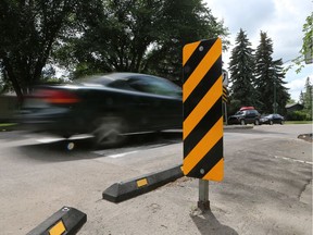 A car slows down and drives over the speed hump on Wilson Crescent in Saskatoon on July 13, 2016.