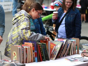 People peruse the library at the Word on the Street book and magazine festival on Broadway Avenue in Saskatoon on September 21, 2017.