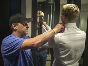 Surviving member of the Humboldt Broncos Graysen Cameron, right, gets some help from his father Tyler Cameron as he gets ready in his hotel room prior the NHL awards at the Hard Rock Hotel in Las Vegas, NV on Tuesday, June 20, 2018.