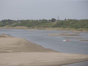 A group of people float down on the South Saskatchewan river near the Gordie Howe Bridge in Saskatoon, Sk on Sunday, June 2, 2019.
