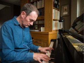 Composer David McIntyre plays his piano in his Regina home. McIntyre is the former director of the Prairie Pride Chorus. BRANDON HARDER/ Regina Leader-Post