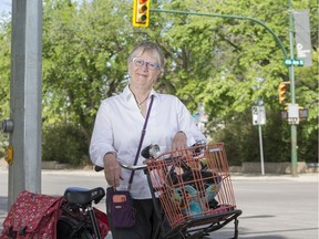 Grandmother and cycling advocate Cathy Watts with her bicycle at the intersection of Fourth Avenue and 23rd Street in Saskatoon, SK on Wednesday, June 5, 2019.