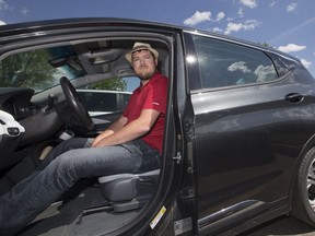 SaskEV founder and electric car advocate Jason Cruickshank in his Chevrolet Bolt.