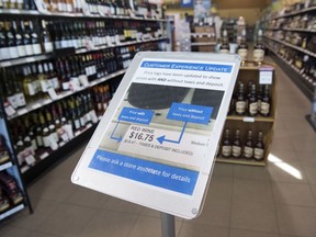 A sign in the entrance of the Victoria East Liquor Store in Regina shows customers how labels on products will now be displayed.