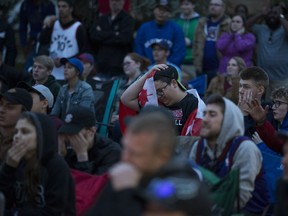 Toronto Raptors fans in Saskatoon react to the team's Game 5 loss during a watch party at City Hall in Saskatoon on June 10, 2019.