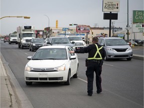 Members of the Regina Police Service, RCMP, Moose Jaw Police Service and Saskatchewan Highway Patrol take part in a combined traffic enforcement project in Regina on June 12. SGI is reporting a record number of driving offences committed by Saskatchewan drivers in May.