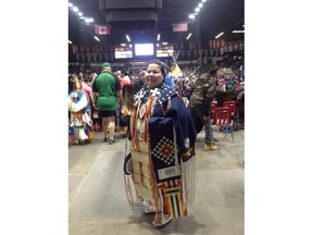 Annie Brass stands in her regalia for a traditional women's dance.