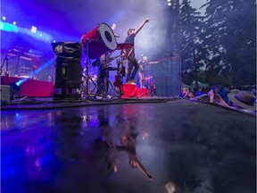 Rain water on the stage while Walk Off the Earth performs at the Saskatchewan Jazz Festival at the mainstage, in the Bessborough Gardens in Saskatoon, SK on Friday, June 21, 2019.