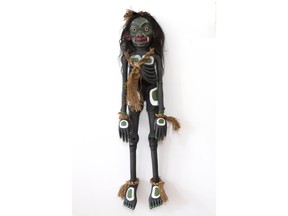 Beau Dick, Winalagalis (War Spirit) Puppet, western red cedar, acrylic, cedar bark, graphite, 152.4 x 50.8 x 30.5 cm. is on display at Remai Modern.