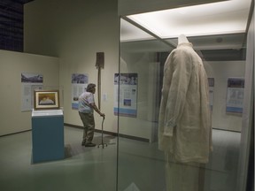 A visitor looks at a Doukhobor showcase during the opening day of the Saskatchewan Doukhobor exhibit at the Western Development Museum in Saskatoon, SK on Saturday, June 29, 2019.