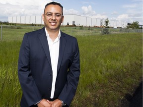 Amazon director of Regional Operations Vibhore Arora stands in front of the under construction new fulfillment centre in Leduc County on Tuesday, June 25, 2019 .