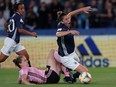 Argentina's defender Aldana Cometti is fouled during the France 2019 Women's World Cup Group D football match between Scotland and Argentina, on June 19, 2019, at the Parc des Princes stadium in Paris.