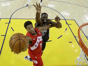 Toronto Raptors guard Kyle Lowry (7) shoots the ball against Golden State Warriors forward Draymond Green (23) in game four of the 2019 NBA Finals at Oracle Arena.