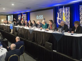 Saskatchewan Party cabinet ministers sit during a question and answer session with members of the Saskatchewan Urban Municipalities Association meeting at the Queensbury Convention Centre.