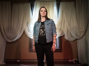 Cat Abenstein stands on stage at the Creative City Centre on Hamilton Street. Abenstein is a writer who is participating in the Coming Out Monologues, taking place at SPACE in Regina on June 12.