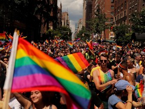 Marchers walk down 5th Avenue as they part in the 2019 World Pride NYC and Stonewall 50th LGBTQ Pride Parade in New York, U.S., June 30, 2019. REUTERS/Lucas Jackson