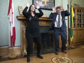 Deputy Mayor Linda Otnes Henriksen of Stor-Elvdal, Norway, and Premier Scott Moe perform a moose dance in part of a "moose truce" at the Legislative Building in Regina.