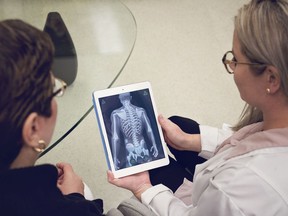 A nurse demonstrates the SKPatient app on a tablet. SKPatient uses 3D graphics technology to explain surgeries to prospective patients prior to getting a procedure. (submitted photo)