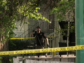 In this file photo, a Regina Police Service forensics officer operates what appears to be a 3D laser scanner, used for scene mapping, on the 1500 block of Cameron Street.