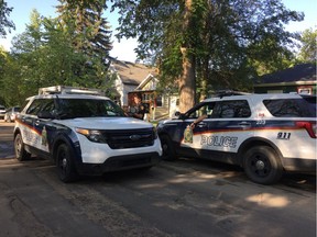 Saskatoon Police Service and Saskatoon Fire and Protective Services are stationed outside 229 Ave F North on Fri. July 6, 2018, roughly five hours after emergency services were called in to battle a blaze in the rear of the house around 2:30 a.m. During the response, firefighters searched the home and found the body of Crystal McFadyen.