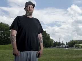 STR8 UP member and Pleasant Hill community association member Shane Partridge stands for a photograph in Pleasant Hill Park playground, where he had a shotgun pointed at him last week, in Saskatoon, SK on Monday, July 8, 2019. Pleasant Hill community association held an emergency meeting to address the spate of violent crime in the area.