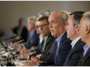 B.C. Premier John Horgan responds to a question at the Council of the Federation in Saskatoon on Thursday, July 11, 2019